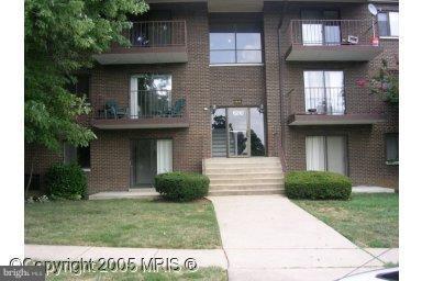 6210 Edsall Road, Unit 201 Alexandria, VA 22312 - Photo 1 of 1 a front view of a house with garden