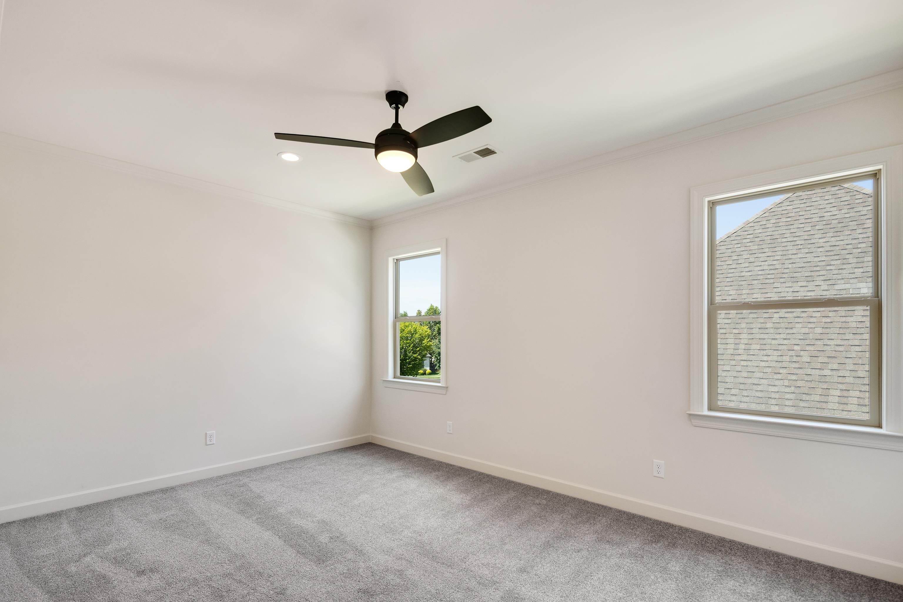 3406 Village Cross Loop Collierville, TN 38017 - Photo 30 of 40 Recessed lighting, ceiling fan with integrated light, two windows with white trim, and gray carpet