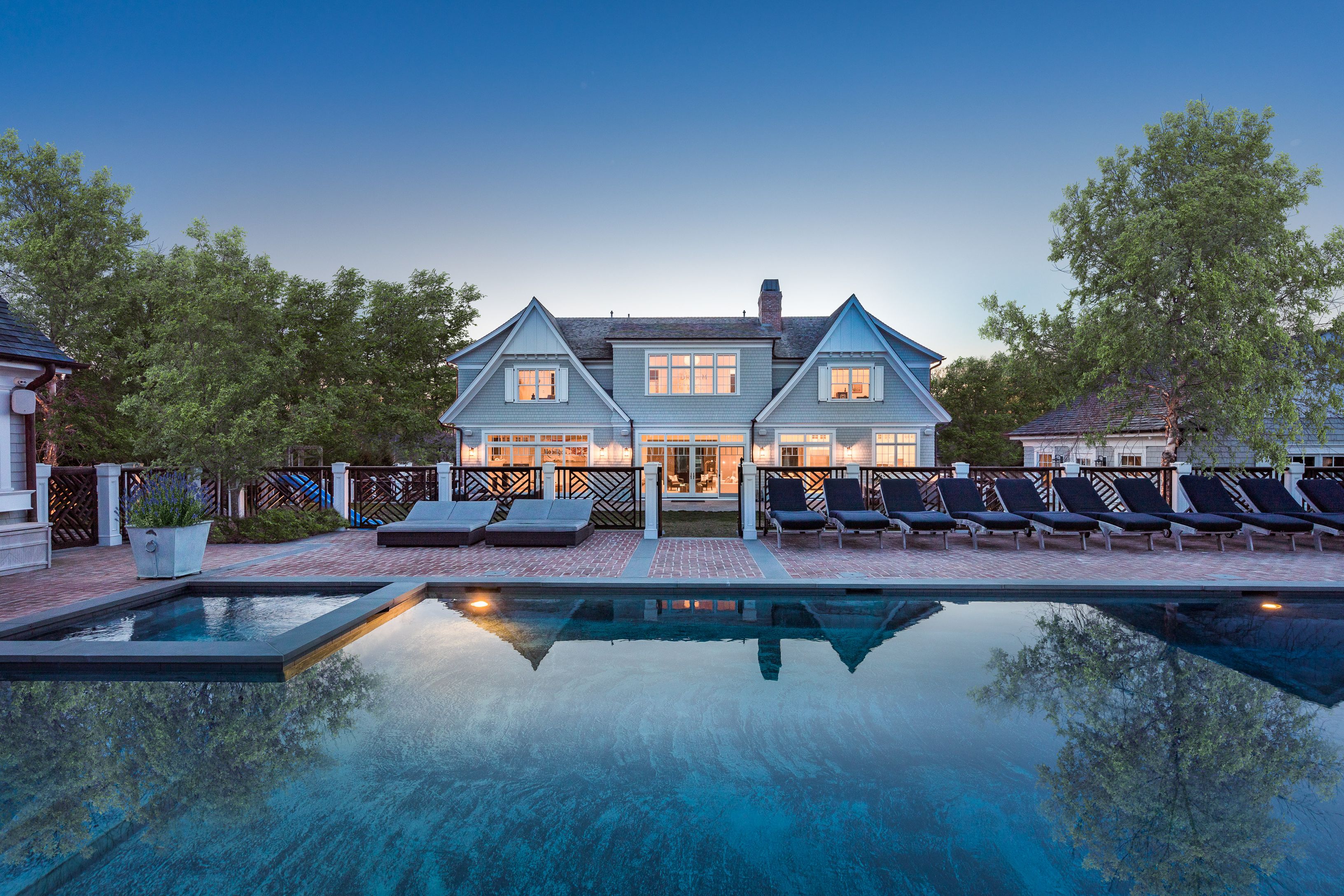 a view of a house with pool and yard