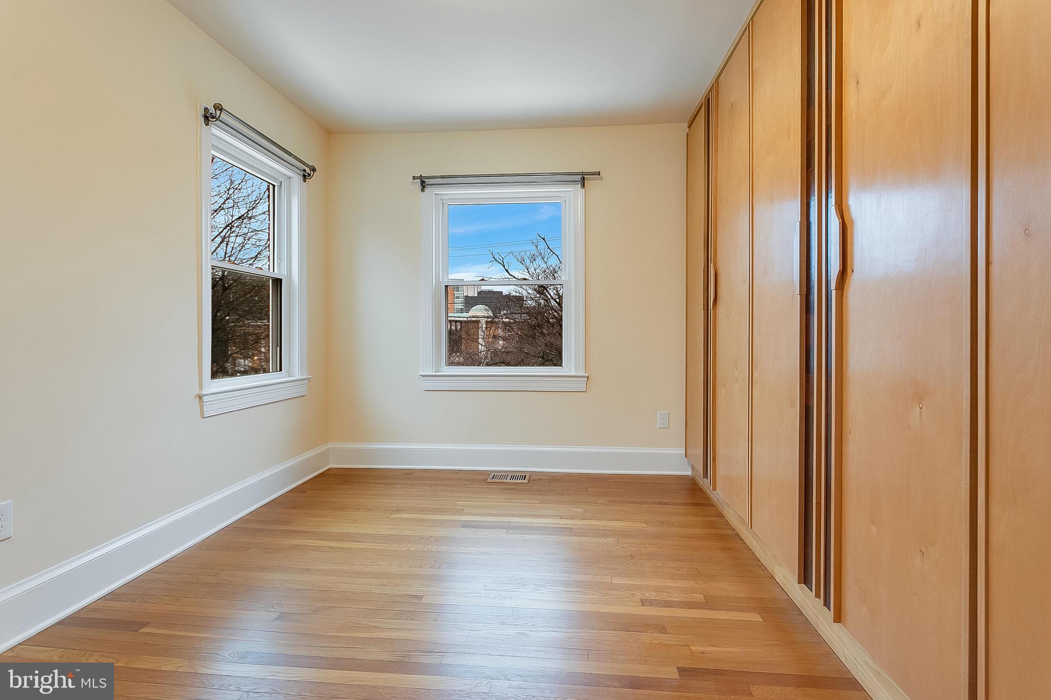 4604 Nottingham Drive Chevy Chase, MD 20815 - Photo 11 of 35 a view of an empty room with wooden floor and a window