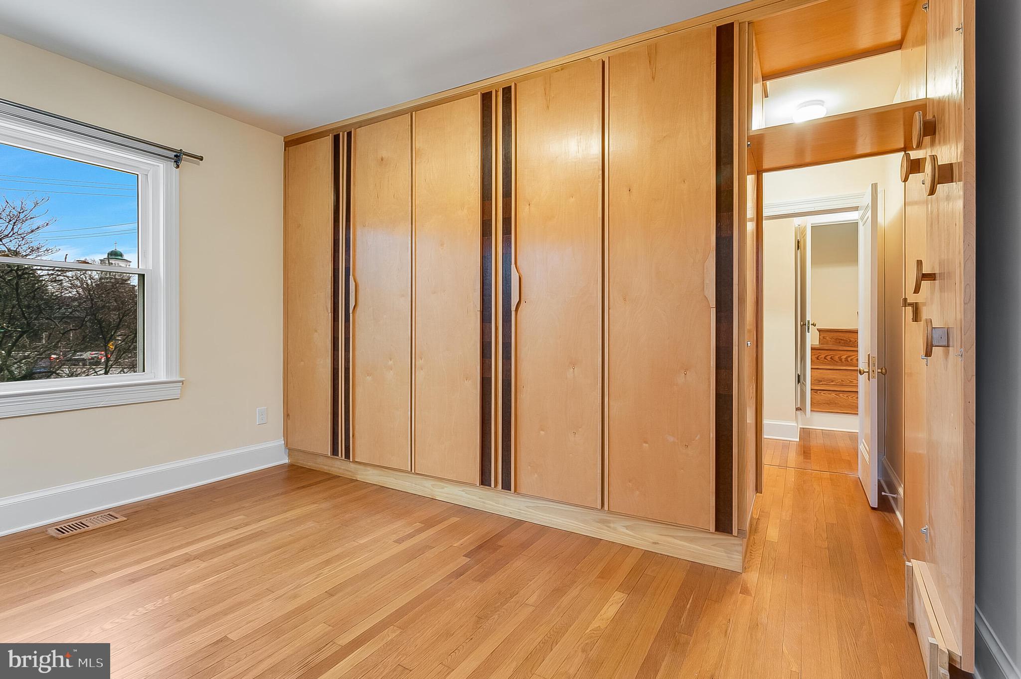 4604 Nottingham Drive Chevy Chase, MD 20815 - Photo 12 of 35 a view of an empty room with window and wooden floor