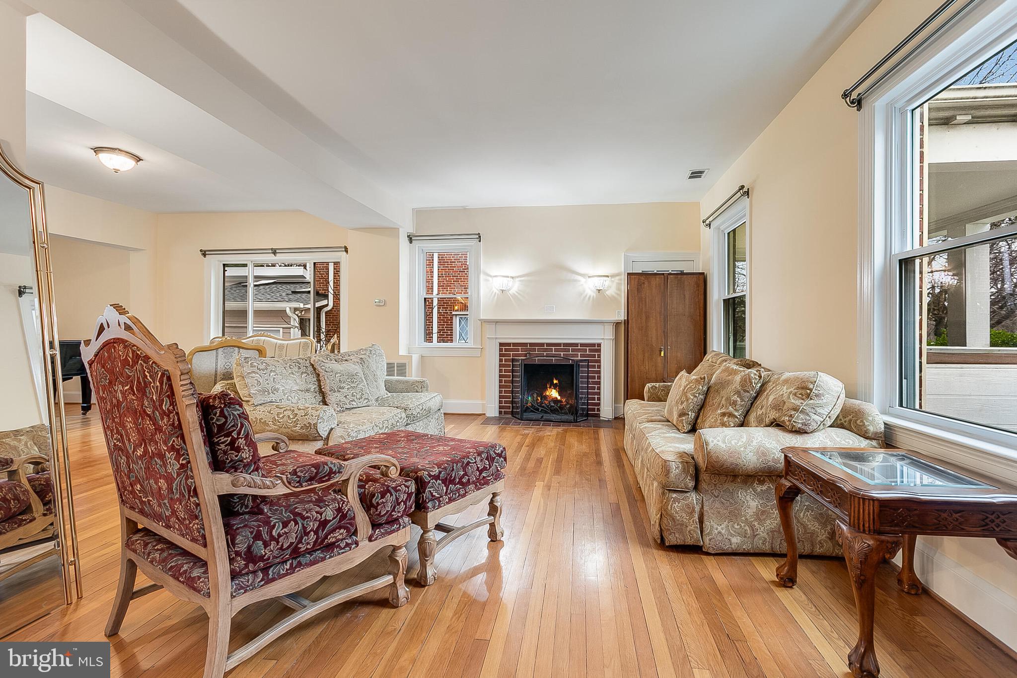 4604 Nottingham Drive Chevy Chase, MD 20815 - Photo 3 of 35 a living room with furniture and a fireplace