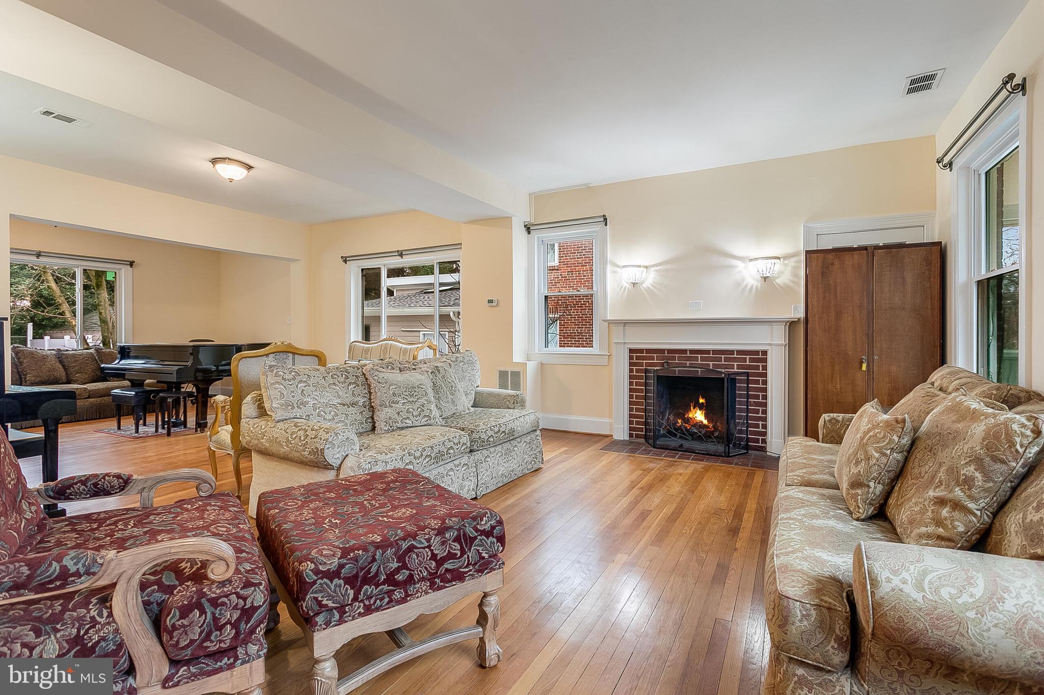 4604 Nottingham Drive Chevy Chase, MD 20815 - Photo 5 of 35 a living room with furniture and a fireplace