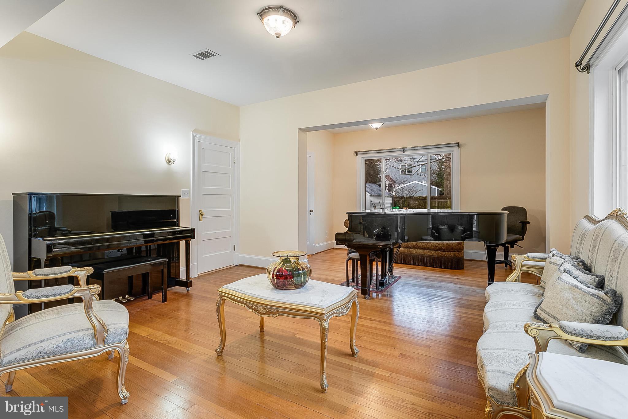 4604 Nottingham Drive Chevy Chase, MD 20815 - Photo 6 of 35 a living room with furniture and a flat screen tv