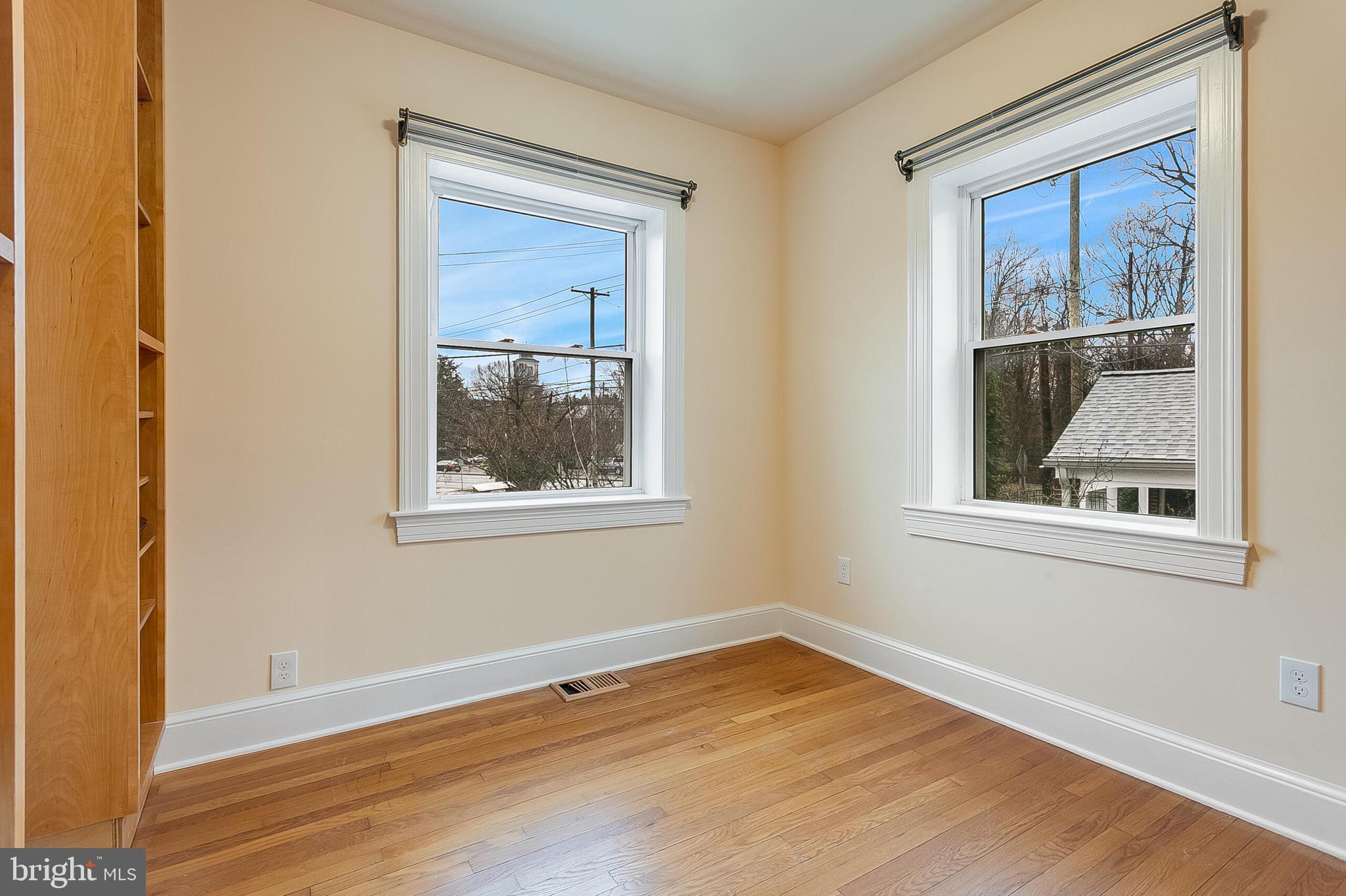 4604 Nottingham Drive Chevy Chase, MD 20815 - Photo 10 of 35 a view of an empty room with a window and wooden floor