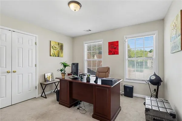 a work room with furniture and windows