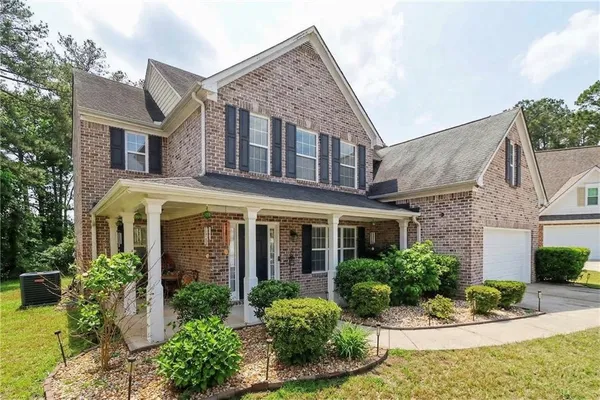 front view of a house with a yard