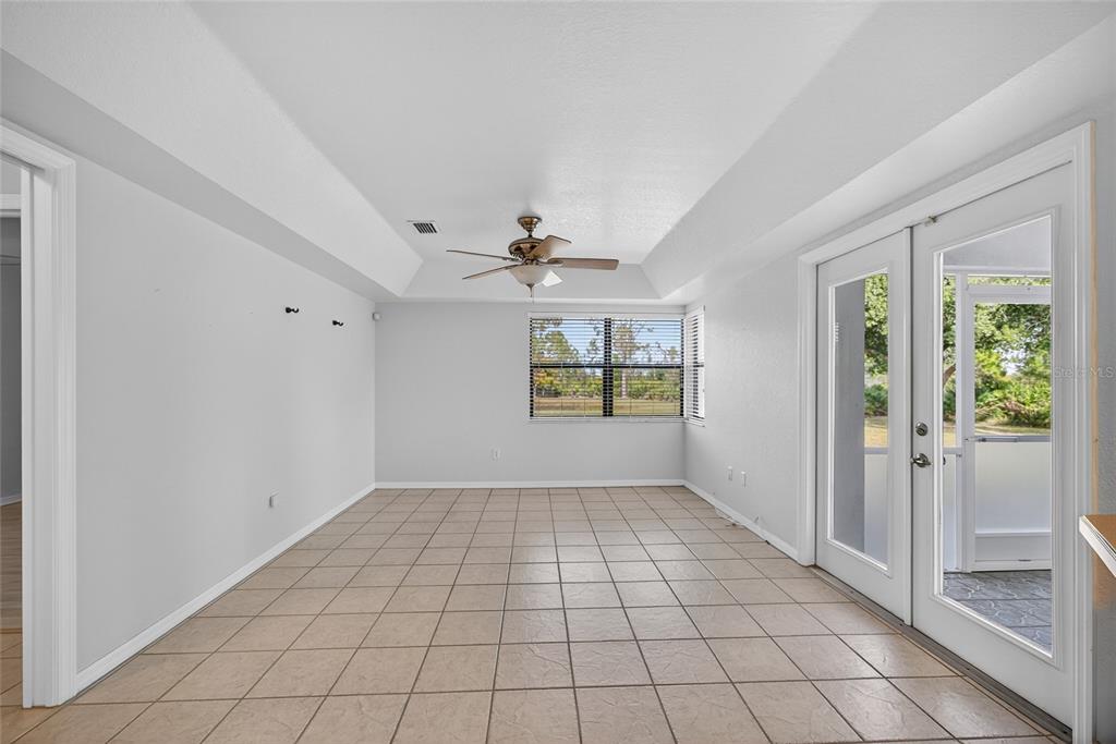 17200 River Ranch Court Punta Gorda, FL 33982 - Photo 13 of 39 a view of an empty room with window and chandelier fan