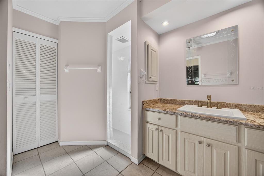 17200 River Ranch Court Punta Gorda, FL 33982 - Photo 17 of 39 a bathroom with a granite countertop sink and a mirror