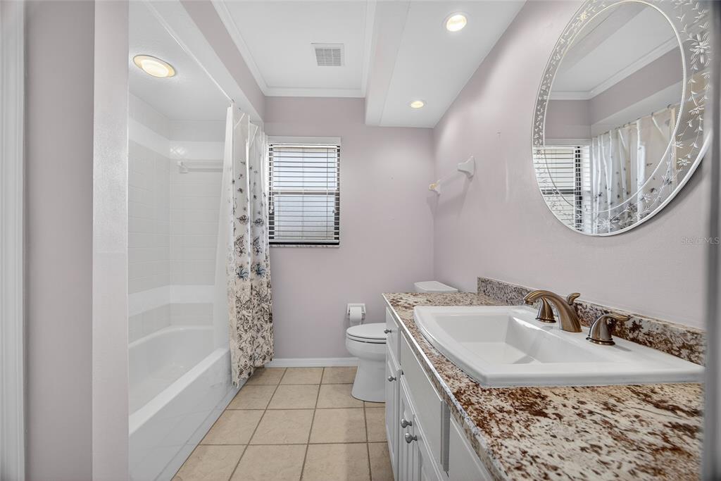 17200 River Ranch Court Punta Gorda, FL 33982 - Photo 20 of 39 a bathroom with a sink a toilet and shower