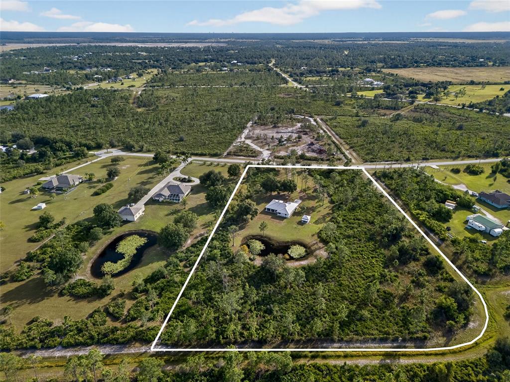 17200 River Ranch Court Punta Gorda, FL 33982 - Photo 2 of 39 an aerial view of a residential houses with outdoor space