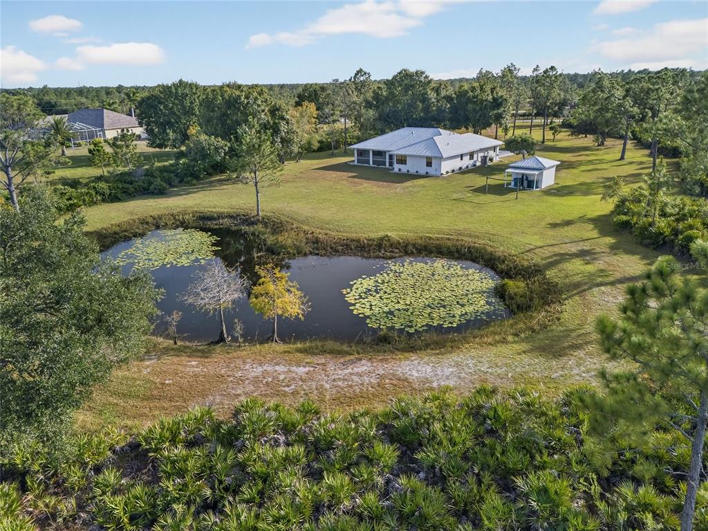17200 River Ranch Court Punta Gorda, FL 33982 - Photo 27 of 39 a view of a garden with a lake