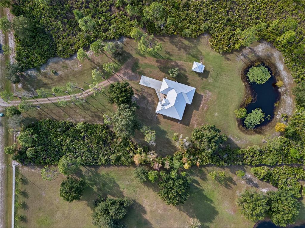 17200 River Ranch Court Punta Gorda, FL 33982 - Photo 30 of 39 an aerial view of a house with a yard and garden