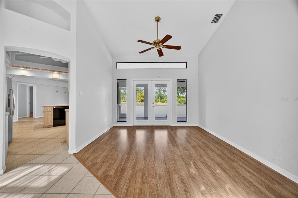17200 River Ranch Court Punta Gorda, FL 33982 - Photo 4 of 39 a view of a hallway with wooden floor and a living room