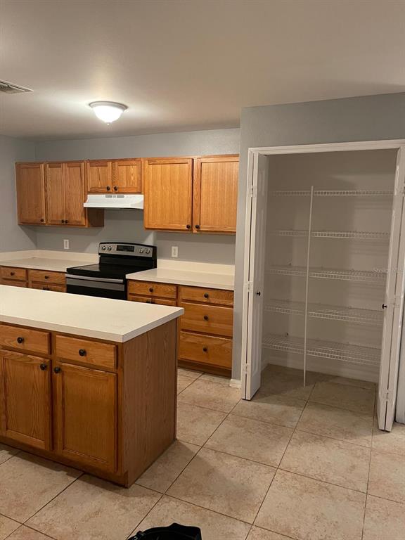 30404 Pongo Way Wesley Chapel, FL 33545 - Photo 12 of 15 a kitchen with kitchen island cabinets and window