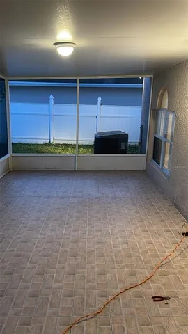 a view of room with a projector and a fireplace