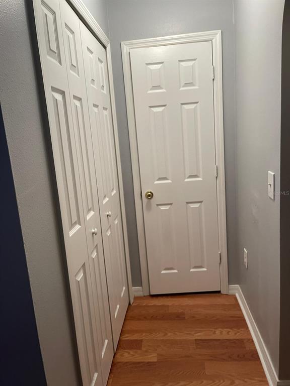 30404 Pongo Way Wesley Chapel, FL 33545 - Photo 3 of 15 an empty room with wooden floor