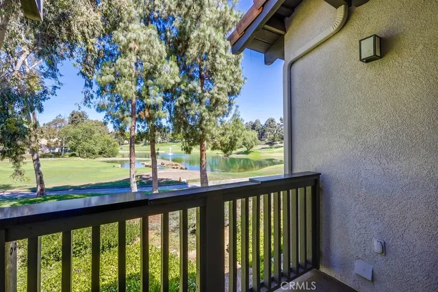 a view of a balcony with a tree