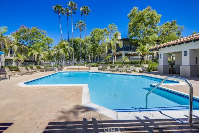 a view of a swimming pool with a patio