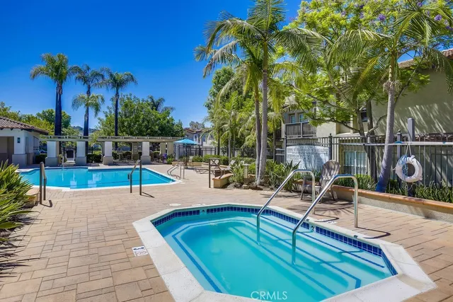 a view of a swimming pool with a patio