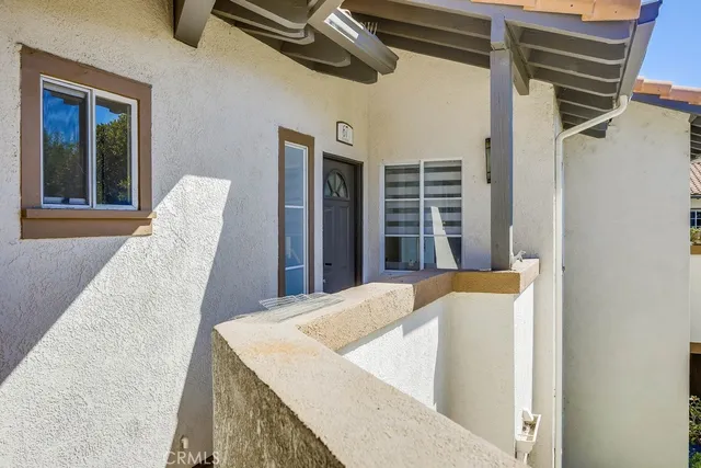a view of living room with furniture and window