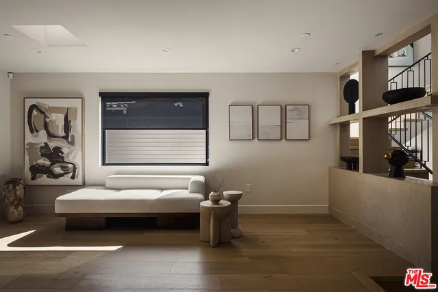 a spacious bedroom with a bed and window