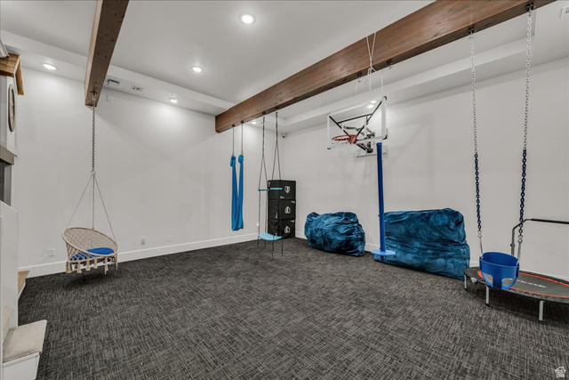 2608 Canyon Ridge Drive St. George, UT 84770 - Photo 74 of 86 Spacious playroom featuring exposed ceiling beams, recessed lighting, and patterned carpet flooring