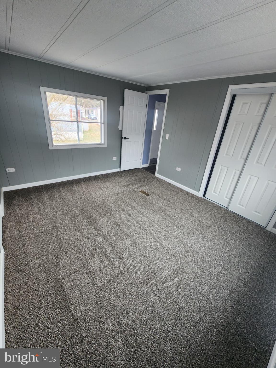 4191 Lake Road, Unit 48 Newfield, NJ 08344 - Photo 13 of 16 a view of an empty room with a window