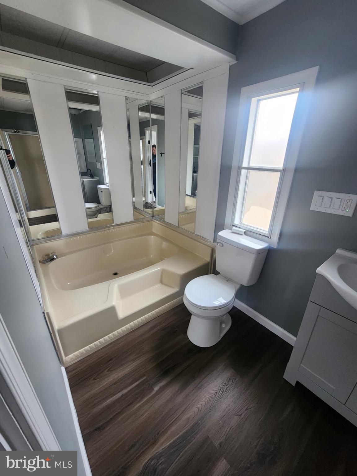 4191 Lake Road, Unit 48 Newfield, NJ 08344 - Photo 14 of 16 a bathroom with a sink and a bathtub