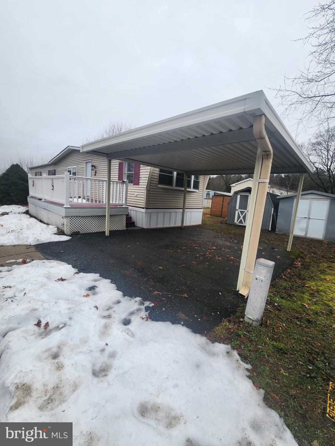 4191 Lake Road, Unit 48 Newfield, NJ 08344 - Photo 2 of 16 a front view of a house with a yard