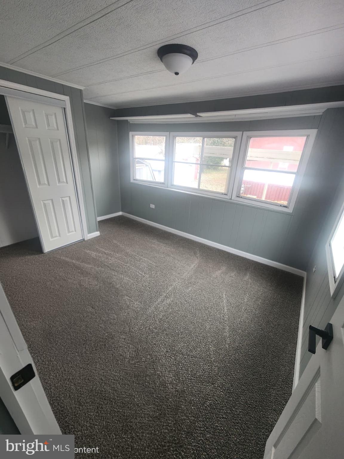 4191 Lake Road, Unit 48 Newfield, NJ 08344 - Photo 4 of 16 a view of an empty room with a window