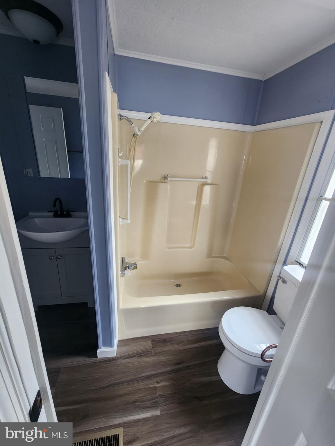 4191 Lake Road, Unit 48 Newfield, NJ 08344 - Photo 5 of 16 a bathroom with a toilet and a bathtub