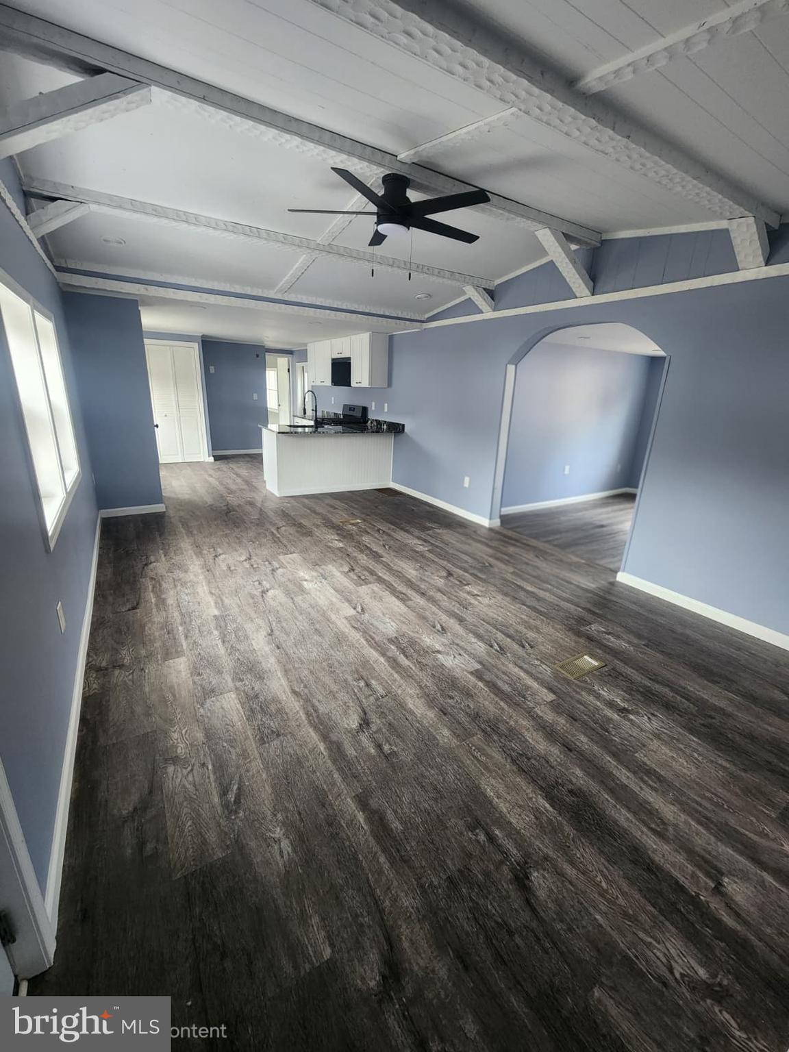 4191 Lake Road, Unit 48 Newfield, NJ 08344 - Photo 7 of 16 a view of empty room with wooden floor