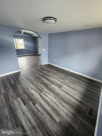 a kitchen with stainless steel appliances a sink a stove a microwave a sink a refrigerator and cabinets