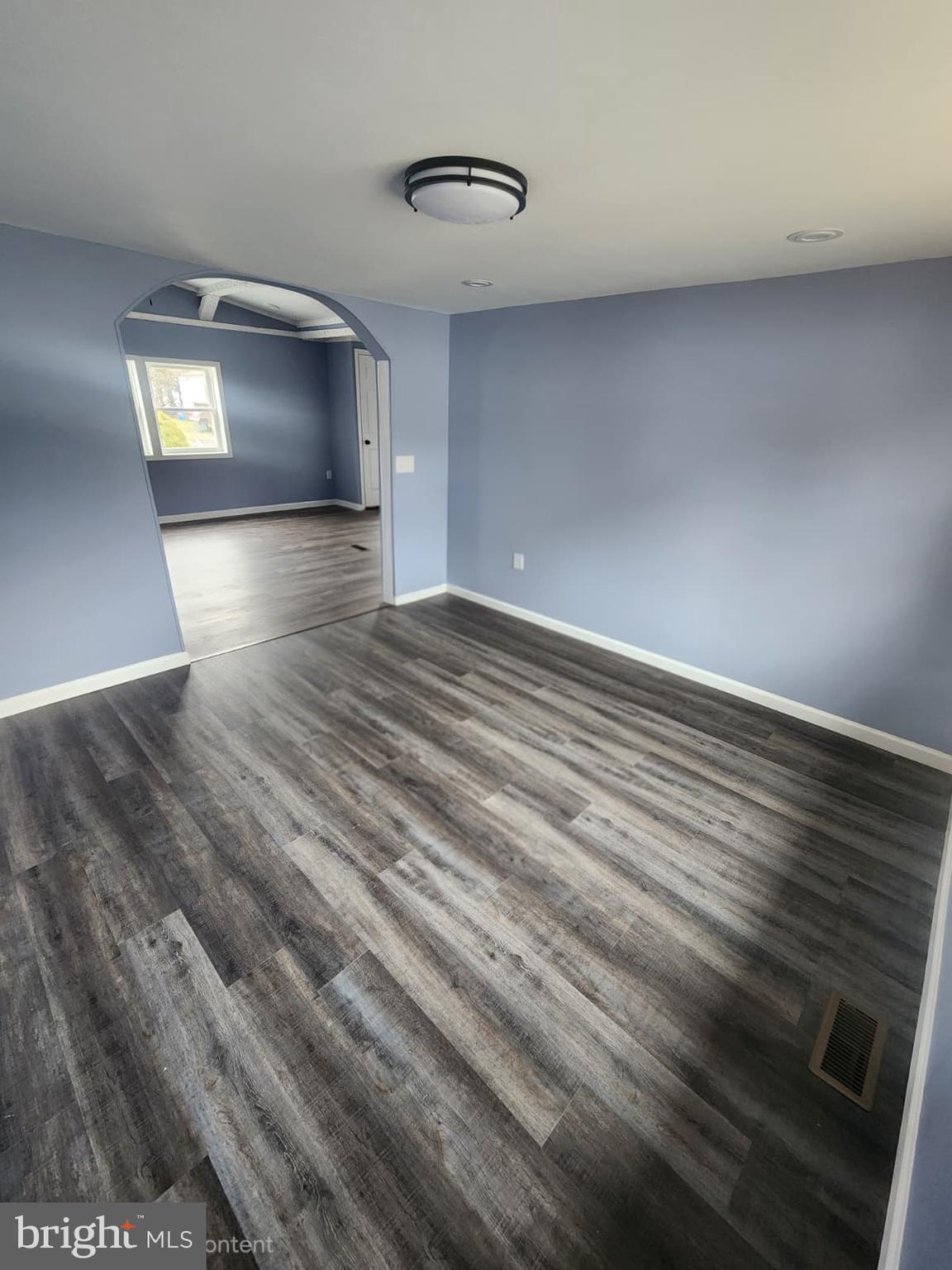 4191 Lake Road, Unit 48 Newfield, NJ 08344 - Photo 8 of 16 a view of empty room with wooden floor
