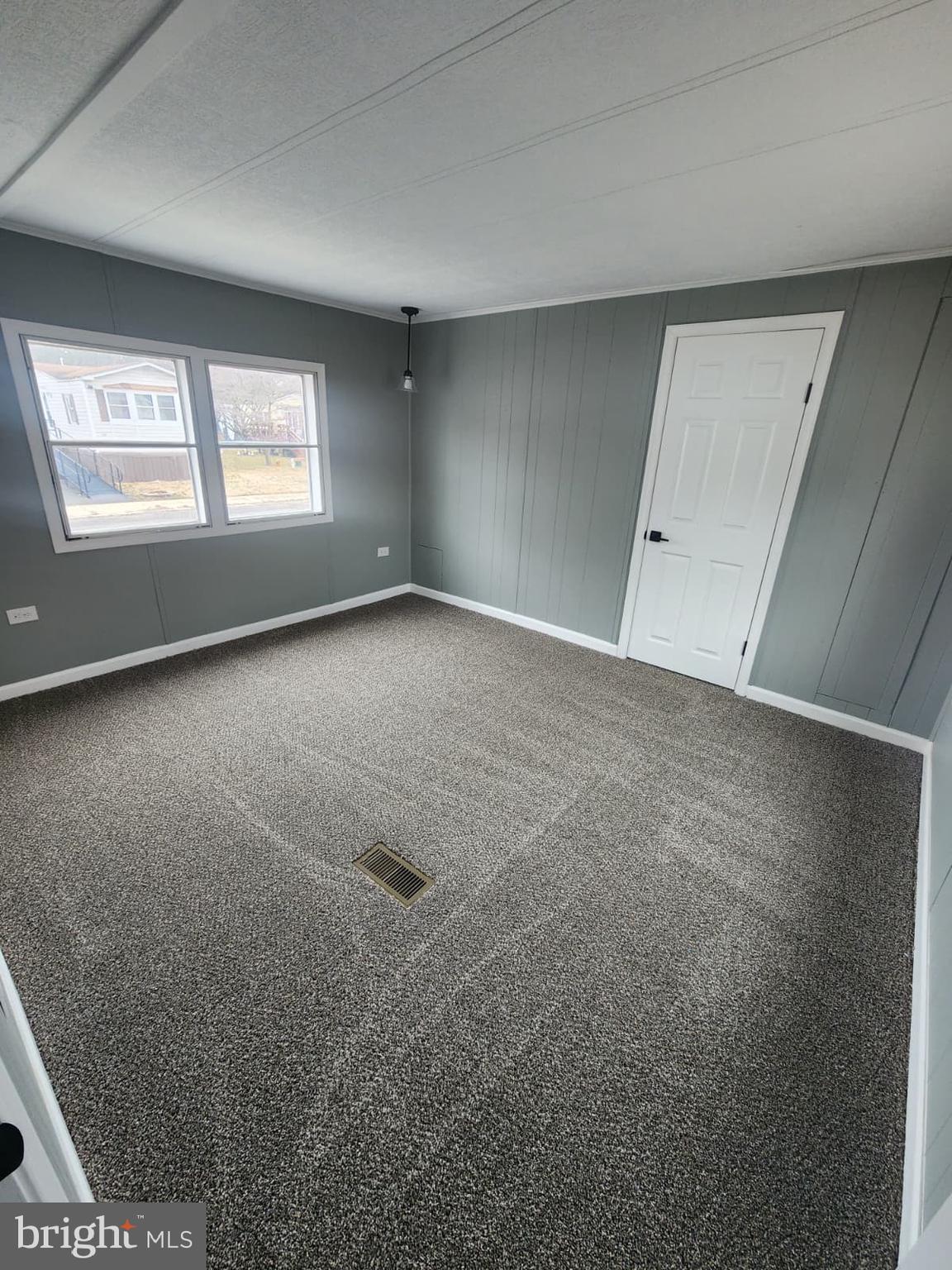 4191 Lake Road, Unit 48 Newfield, NJ 08344 - Photo 10 of 16 a view of an empty room with a window