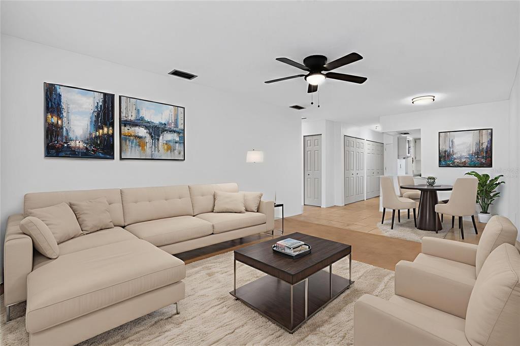 2560 Golf Course Drive, Unit 507 Sarasota, FL 34234 - Photo 2 of 43 a living room with furniture and a wooden floor