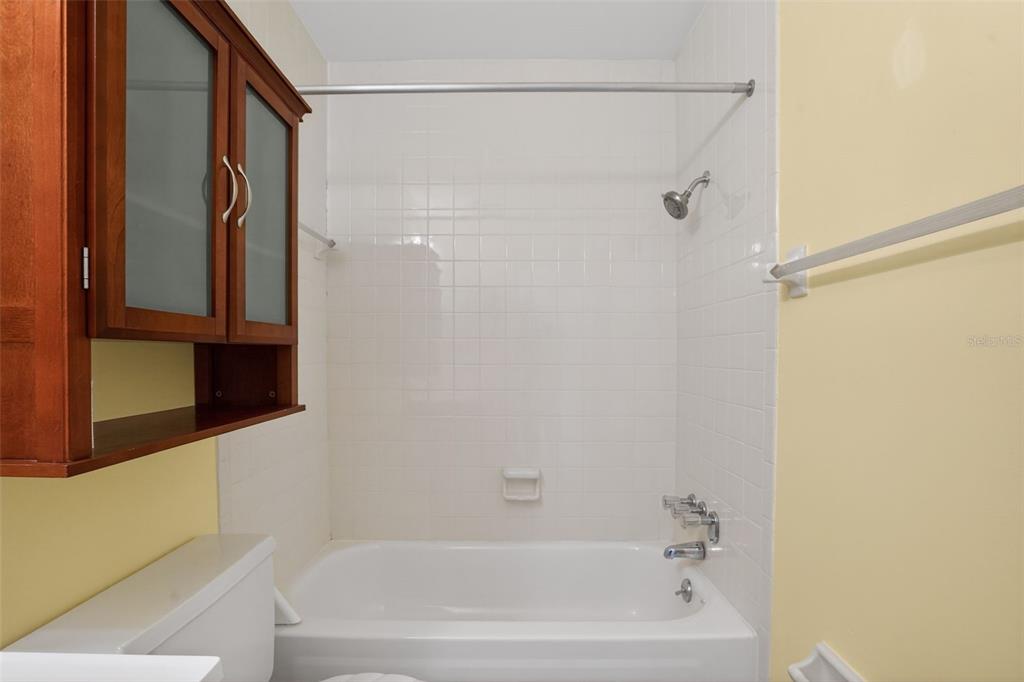 2560 Golf Course Drive, Unit 507 Sarasota, FL 34234 - Photo 25 of 43 a bathroom with a bathtub and a shower