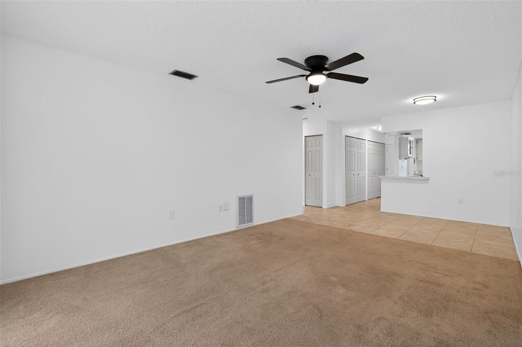 2560 Golf Course Drive, Unit 507 Sarasota, FL 34234 - Photo 3 of 43 a view of empty room with ceiling fan