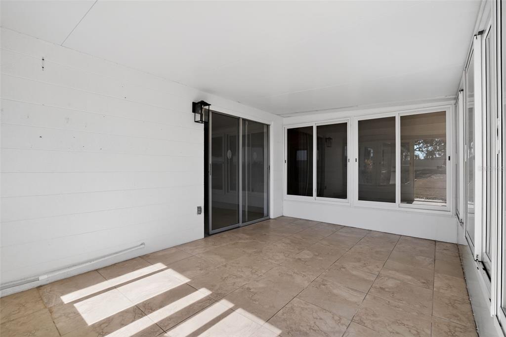 2560 Golf Course Drive, Unit 507 Sarasota, FL 34234 - Photo 33 of 43 a view of an empty room with a window