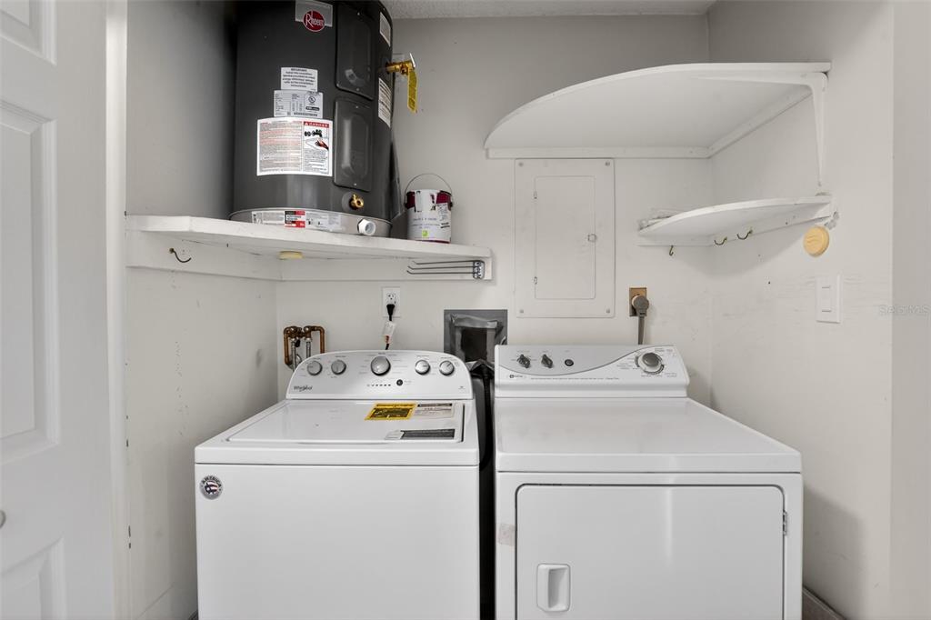 2560 Golf Course Drive, Unit 507 Sarasota, FL 34234 - Photo 34 of 43 a utility room with dryer and washer