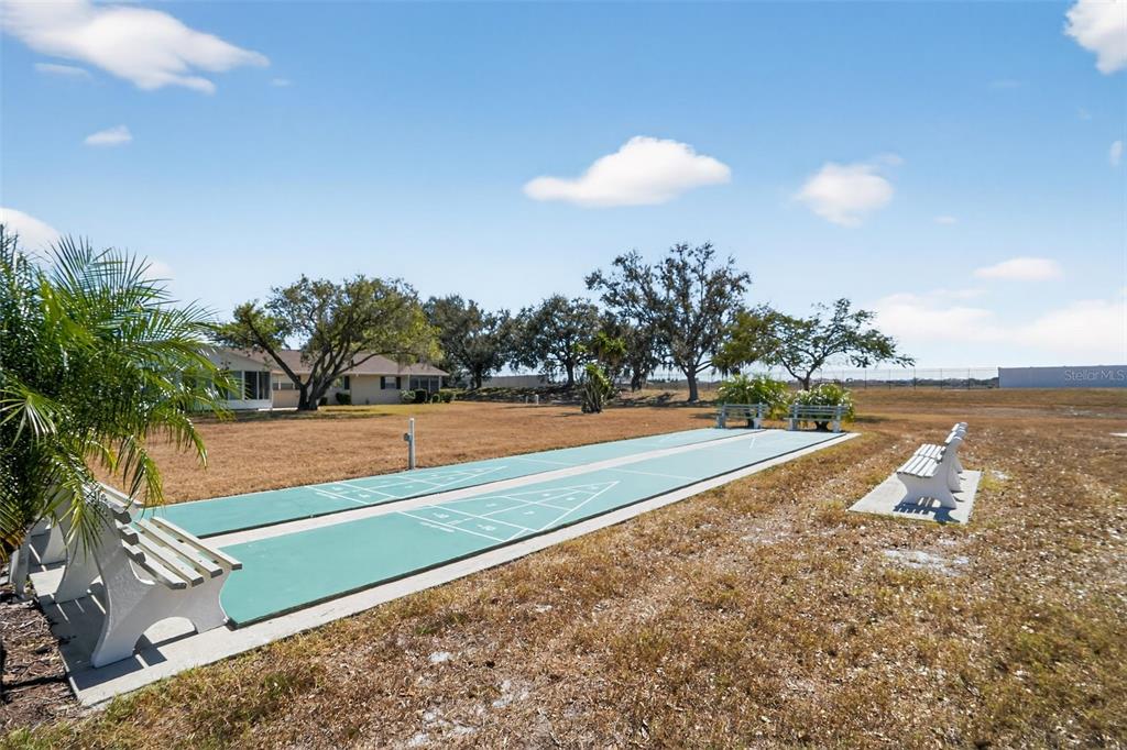 2560 Golf Course Drive, Unit 507 Sarasota, FL 34234 - Photo 36 of 43 a view of a swimming pool with a lake view and mountain view