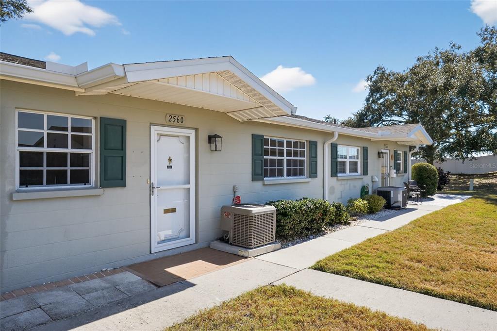 2560 Golf Course Drive, Unit 507 Sarasota, FL 34234 - Photo 40 of 43 a view of a house with backyard and sitting area