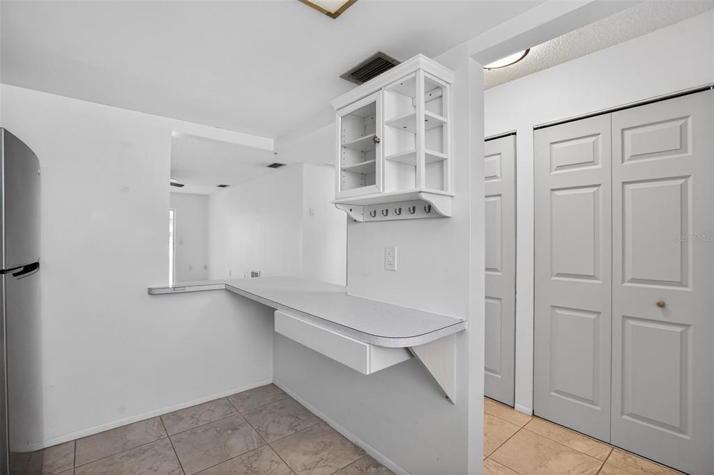 2560 Golf Course Drive, Unit 507 Sarasota, FL 34234 - Photo 7 of 43 a view of walk in closet with white walls