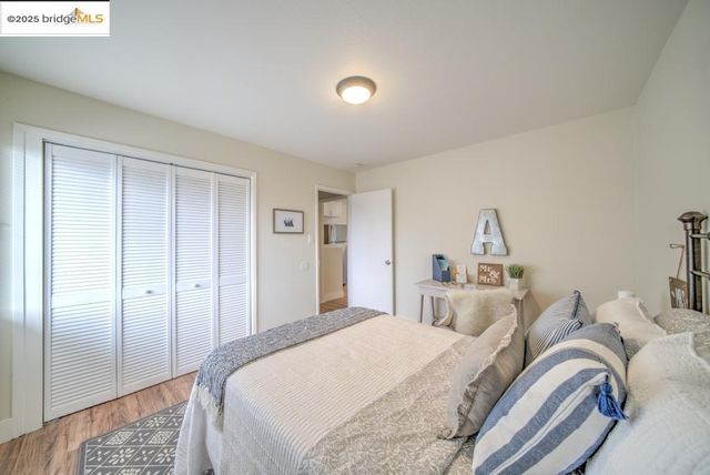 a bedroom with bed and a window