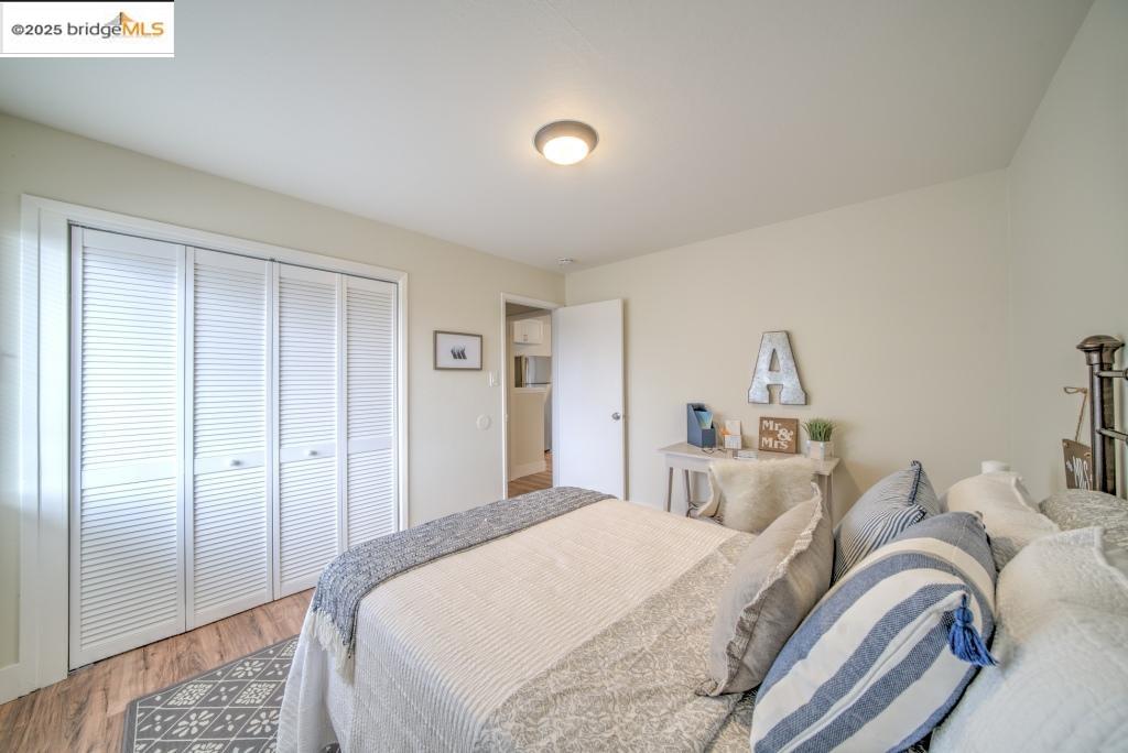 399 Schafer Road Hayward, CA 94544 - Photo 12 of 13 a bedroom with bed and a window