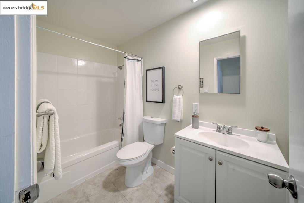 399 Schafer Road Hayward, CA 94544 - Photo 13 of 13 a bathroom with a sink a toilet and shower