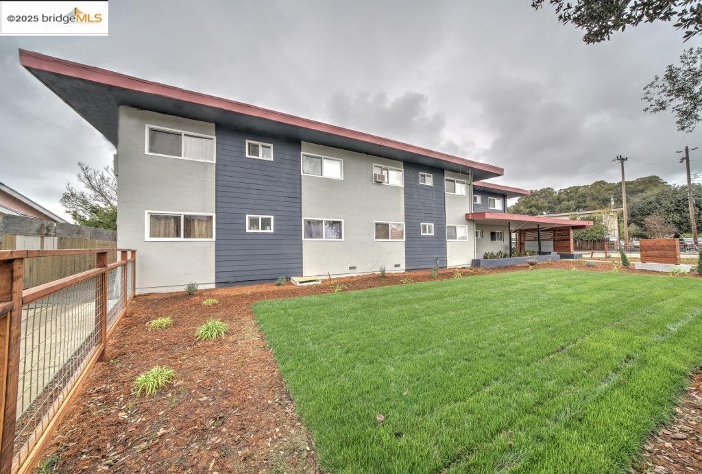 399 Schafer Road Hayward, CA 94544 - Photo 2 of 13 a view of a house with backyard and a garden