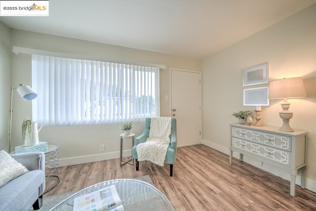 399 Schafer Road Hayward, CA 94544 - Photo 6 of 13 a living room with furniture and a table