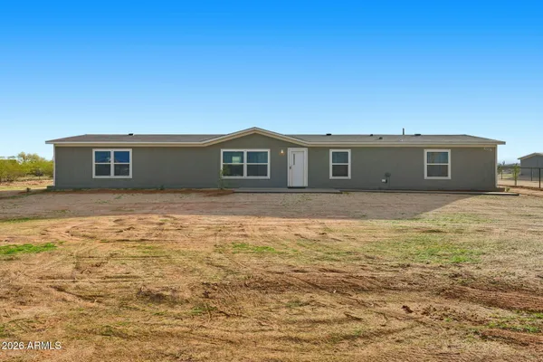 a view of a swimming pool with an ocean view